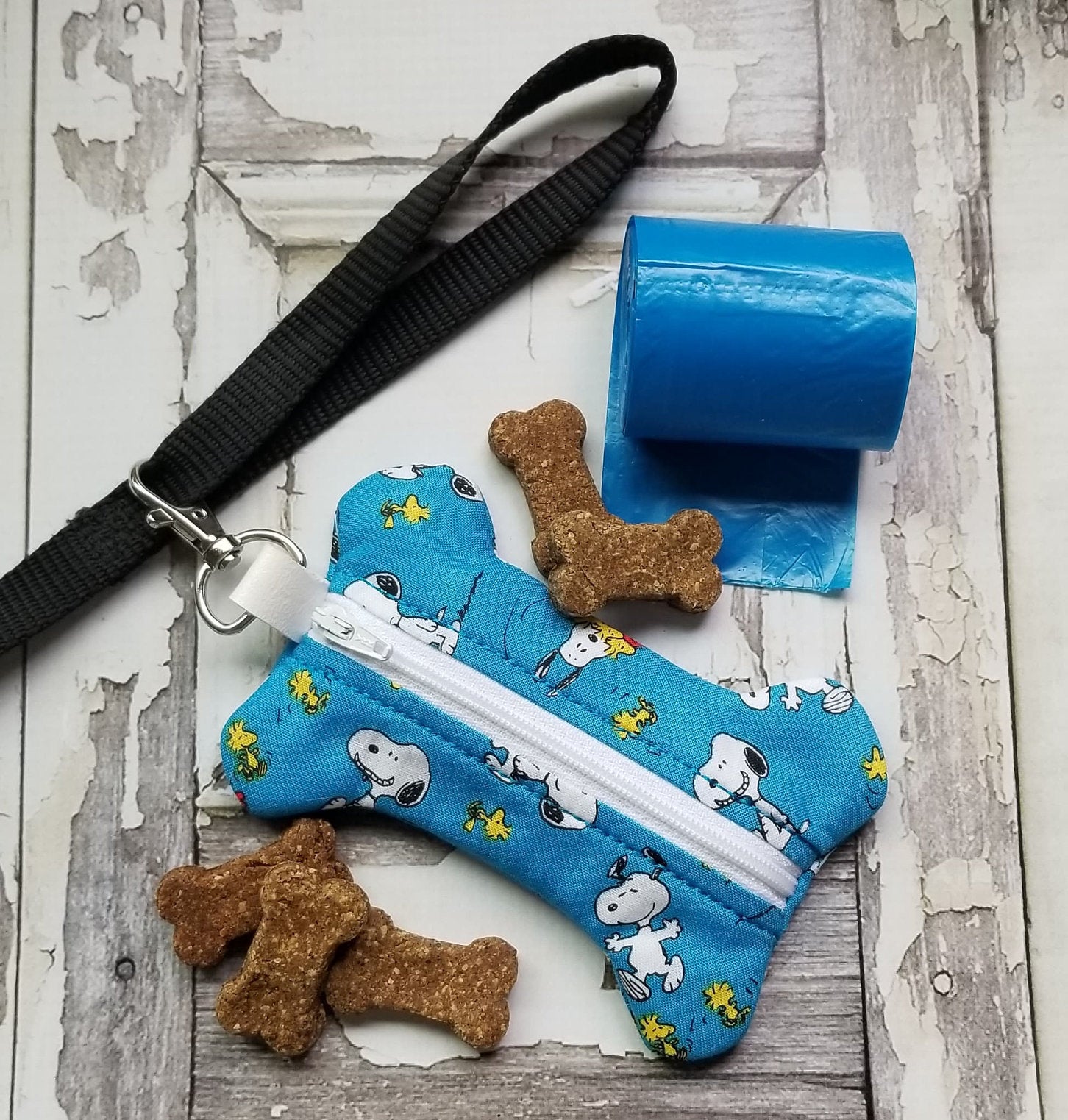 Coffin Shape Dog poop bag dispenser with free roll of bags. Embroidered RIP  and Dog Bone bag opening. Personalization is available